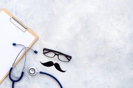 Black glasses with a mustache and stethoscope. Mans health conceptの写真素材
