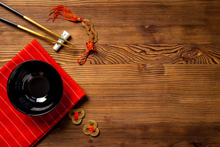 Black and gold chopsticks with red mat. Asian tabble place settingの写真素材
