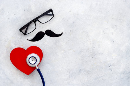 Black glasses with a mustache and stethoscope. Mans health conceptの写真素材