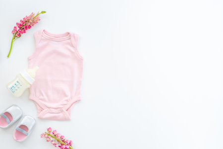 Baby infant cotton clothes with bottle of milk and kids accessoriesの写真素材