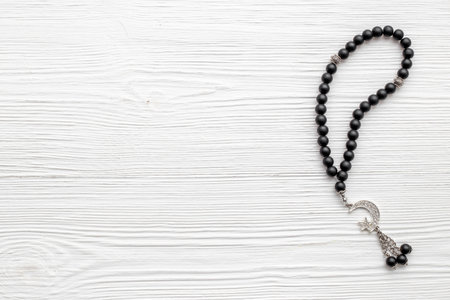 Islamic background with Muslim rosary and silver crescent moonの写真素材