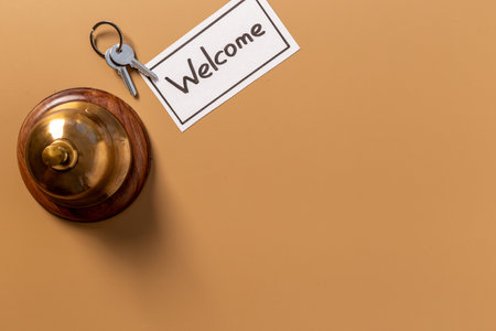 Welcome to the hotel. Hotel service bell on reception desk