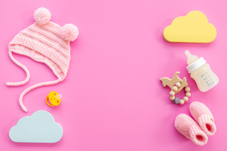 Baby girl pink hat with booties and accessories, top viewの写真素材