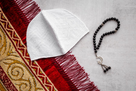 Prayer rug and Koran with Muslim rosary with silver crescent moonの写真素材