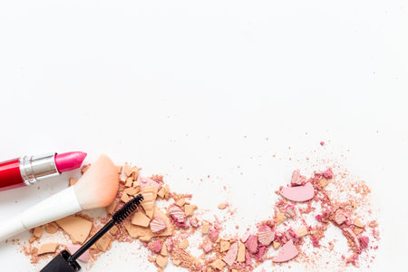 Crumbled makeup powder with brush isolated on white backgroundの写真素材