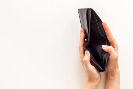 Empty wallet in hands. Inflation and economy concept. Poverty and financial loss.