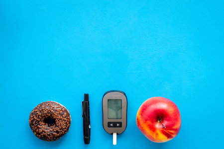 Blood sugar test with lancets. Test after eating food. Diabetes concept.の写真素材