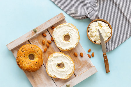 Fresh bagels with cheese cream. Homemade bread background.の写真素材