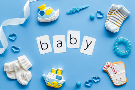 Frame of blue baby boy accessories with toys and gift box, top view.の写真素材