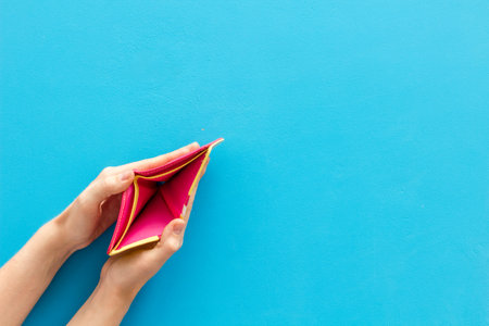 Empty wallet in female hands. Poverty and financial loss concept. Inflation.の写真素材