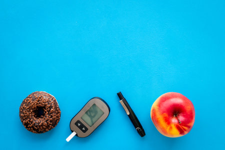 Blood sugar test with lancets. Test after eating food. Diabetes concept.の写真素材