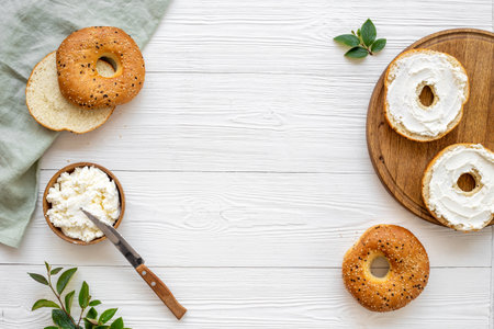 Homemade baked bread bagels with cheese cream. Healthy breakfast background.の写真素材