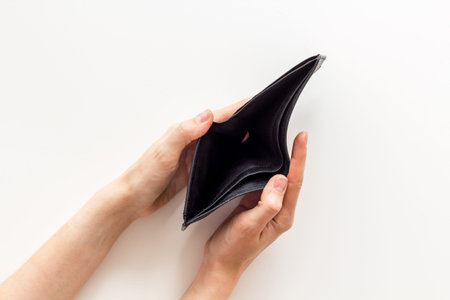 Empty wallet in hands. Inflation and economy concept. Poverty and financial loss.