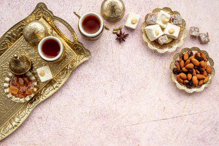 Arab style tea table with tea and sweets. Muslim holiday background.の写真素材