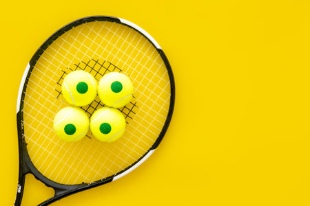 Tennis racquet and balls, top view. Sport games background.の写真素材