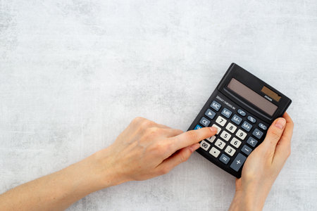 Business accounter working with calculator for taxes accountingの写真素材