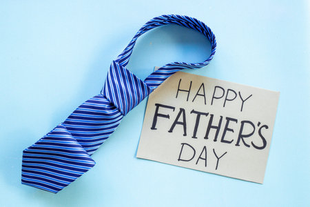 Happy Fathers day postcard with blue tie, top viewの写真素材