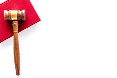 Wooden judge gavel with law book, top view. Law education concept.の写真素材