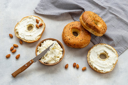 Homemade baked bread bagels with cream. Healthy breakfast background.の写真素材