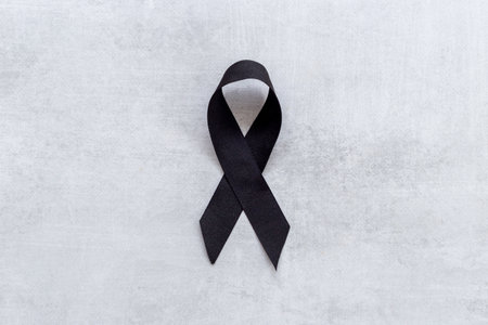 Black ribbon. Symbol of mourning and tragedy.の写真素材