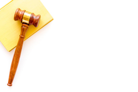 Wooden judge gavel with law book, top view. Law education concept.の写真素材