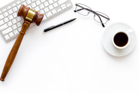 Law student or lawyer workplace with Judge gavel and coffee cup.