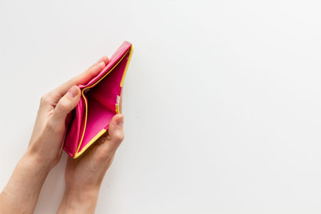 Empty wallet in female hands. Poverty and financial loss concept. Inflation.