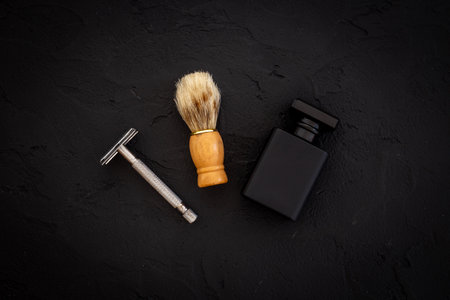 Black perfume bottle for man with shaving accessories.の写真素材