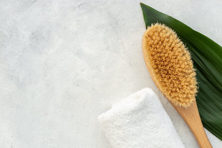 Massage and bath brush with towel. Spa set concept.