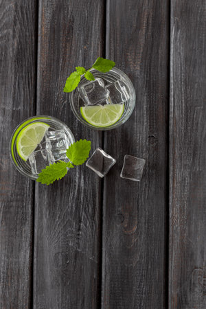 Refreshing cold cocktail with mint in glasses, top view.の写真素材