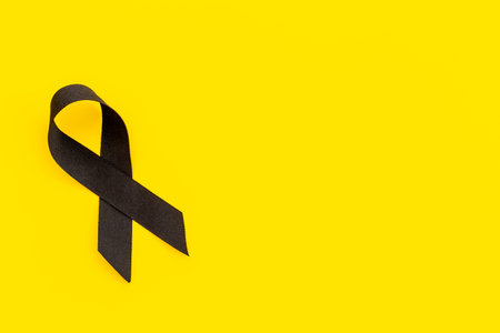 Black silk ribbon symbol of mourning and tragedy.
