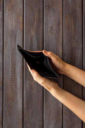 Empty wallet in hands. Inflation and economy concept. Poverty and financial loss.
