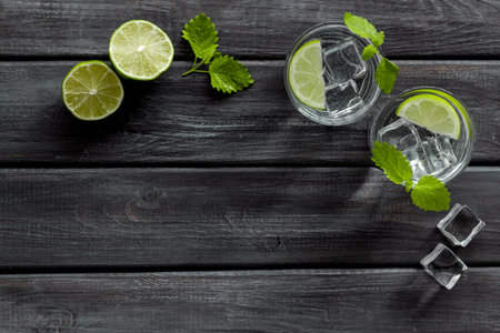 Refreshing cold cocktail with mint in glasses, top view.の写真素材
