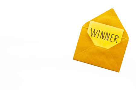 Lottery winner ticket or congratulatory letter on golden letter envelope. Winner concept