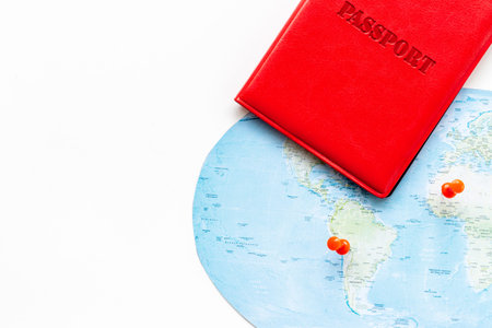 Passport on world map for traveling. Approved visa for vacation trip.の写真素材