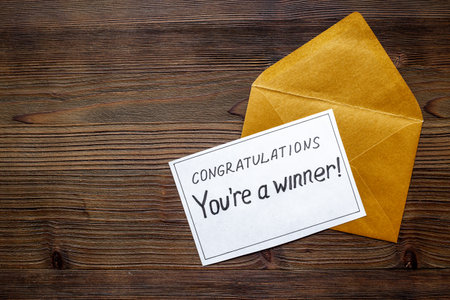 Winner concept. Lottery winner ticket of letter on golden letter envelope.の写真素材