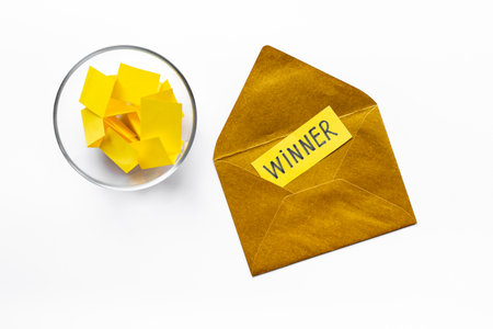 Winner concept. Lottery winner ticket on golden letter envelope.の写真素材