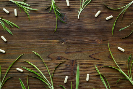 Apothecary of natural wellness. Herbs and medicine on white background, top view frame copy space