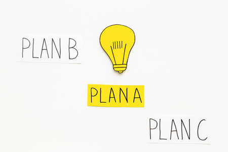Burning light bulb of paper with options of problem solving.