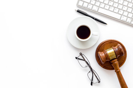 Law student or lawyer workplace with Judge gavel and coffee cup.
