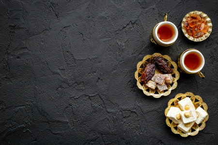 Ramadan party table with tea and sweets. Muslim holiday background.の写真素材