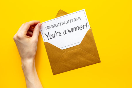Winner concept. Lottery winner ticket of letter on golden letter envelope.の写真素材