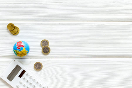 Euro coins and mini globe. World economy concept.の写真素材