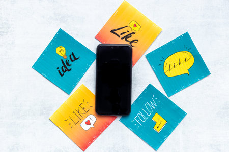 Digital marketing concept with mobile phone and social media icons