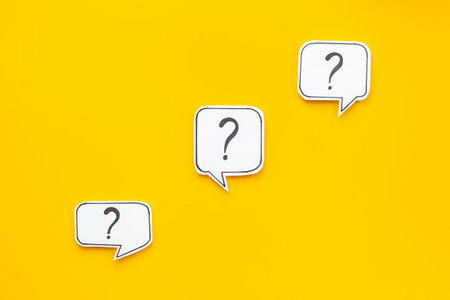 Question marks on paper speech bubbles. FAQ concept or search information concept.の写真素材