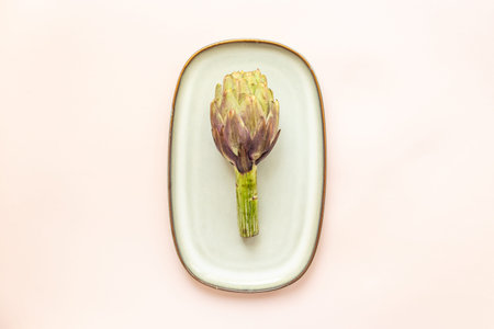 Fresh vegetables - raw artichokes. Green and purple artichoke flower buds.の写真素材