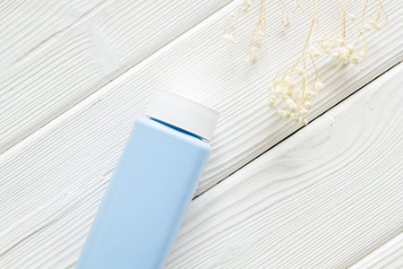 Spilled baby talcum powder. Container with powder for baby body care.の写真素材