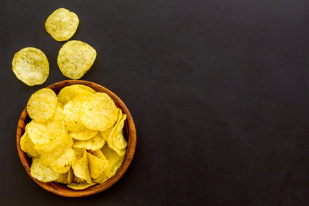 Oven backed low calorie potato chips. Snacks background, top view.の写真素材