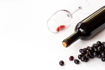 Bottle of wine with wineglass and grapes. Wine background.の写真素材