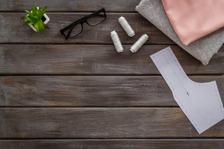 Sewing dress workshop desk top with fashion designer dressmaker accessories.の写真素材